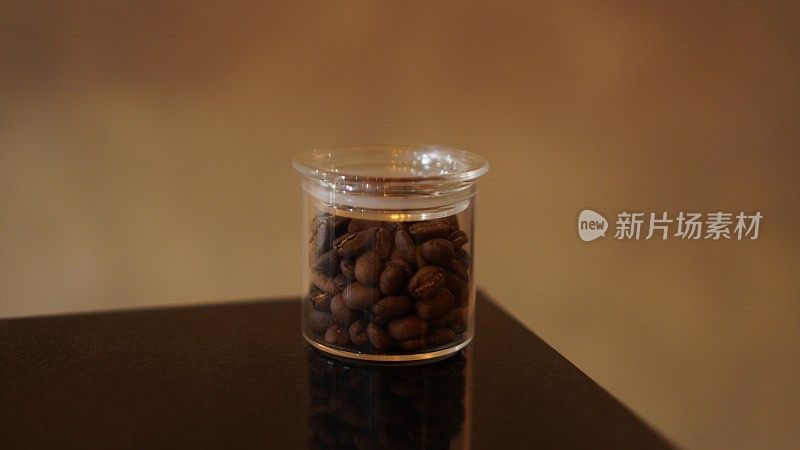 Jars of coffee in a row at the café bar